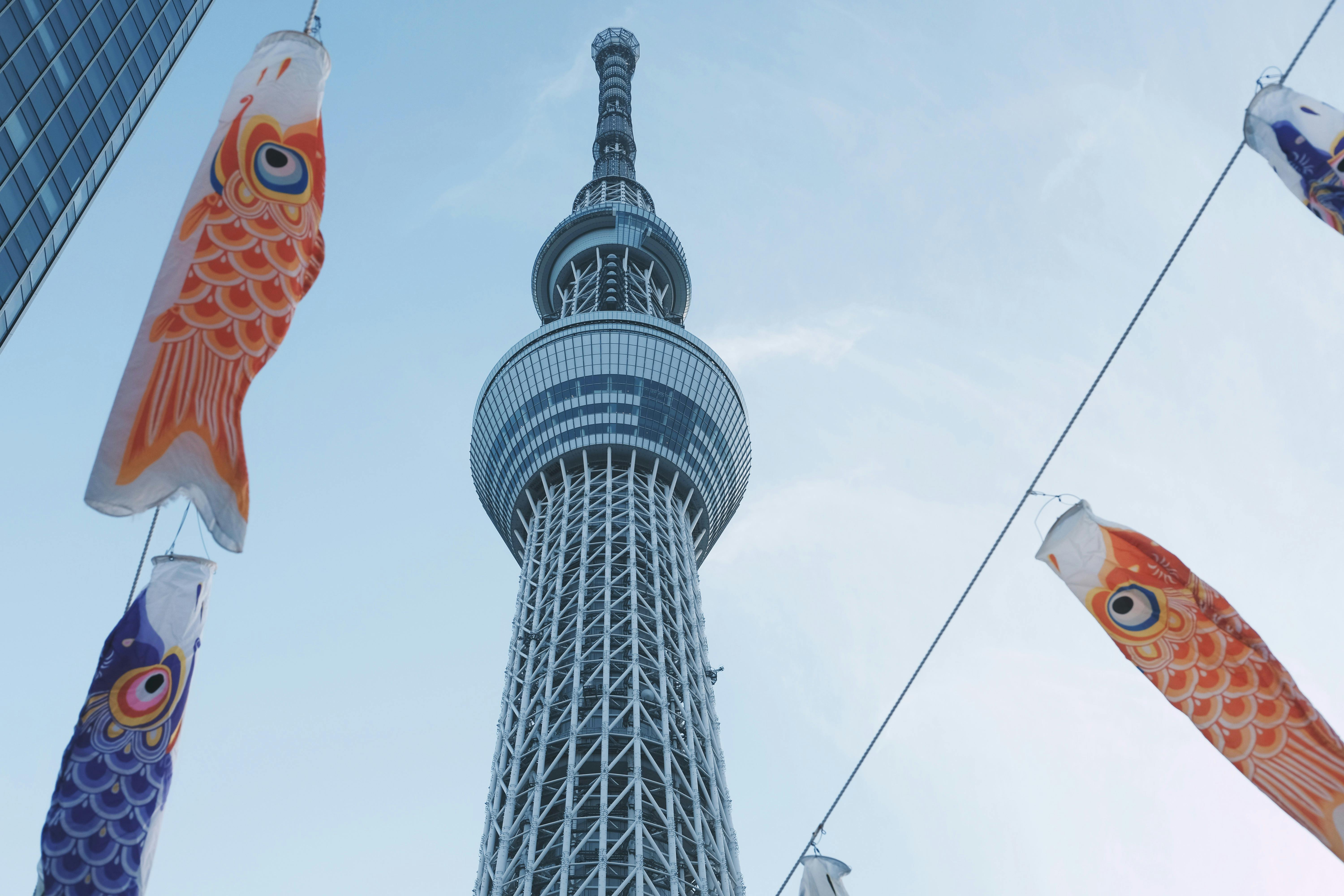 Colorful carp streamers decorate the Tokyo Skytree, symbolizing Japanese cultural celebration.