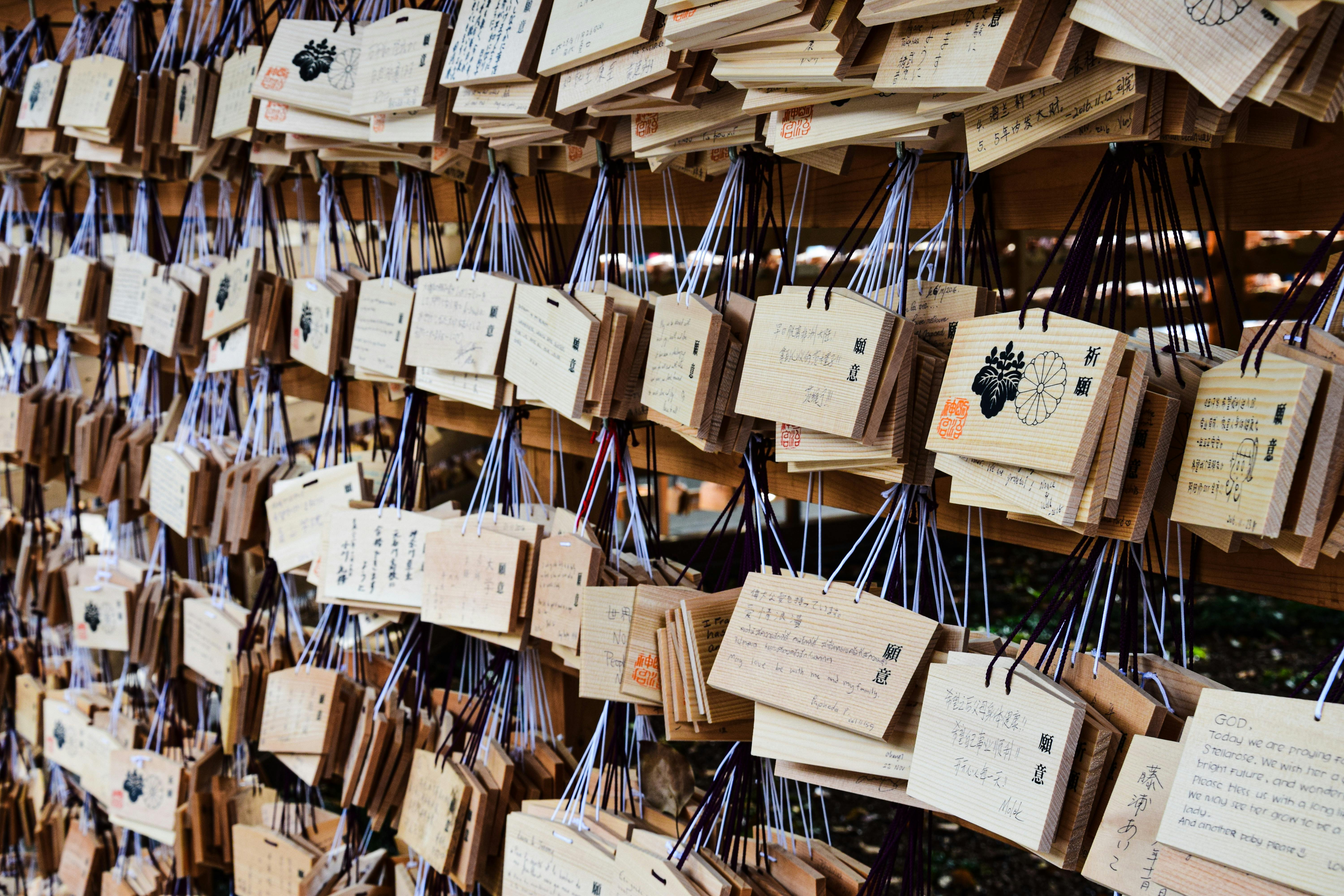 Ema boards hanging at a Shinto shrine in Japan, used for prayers and wishes.