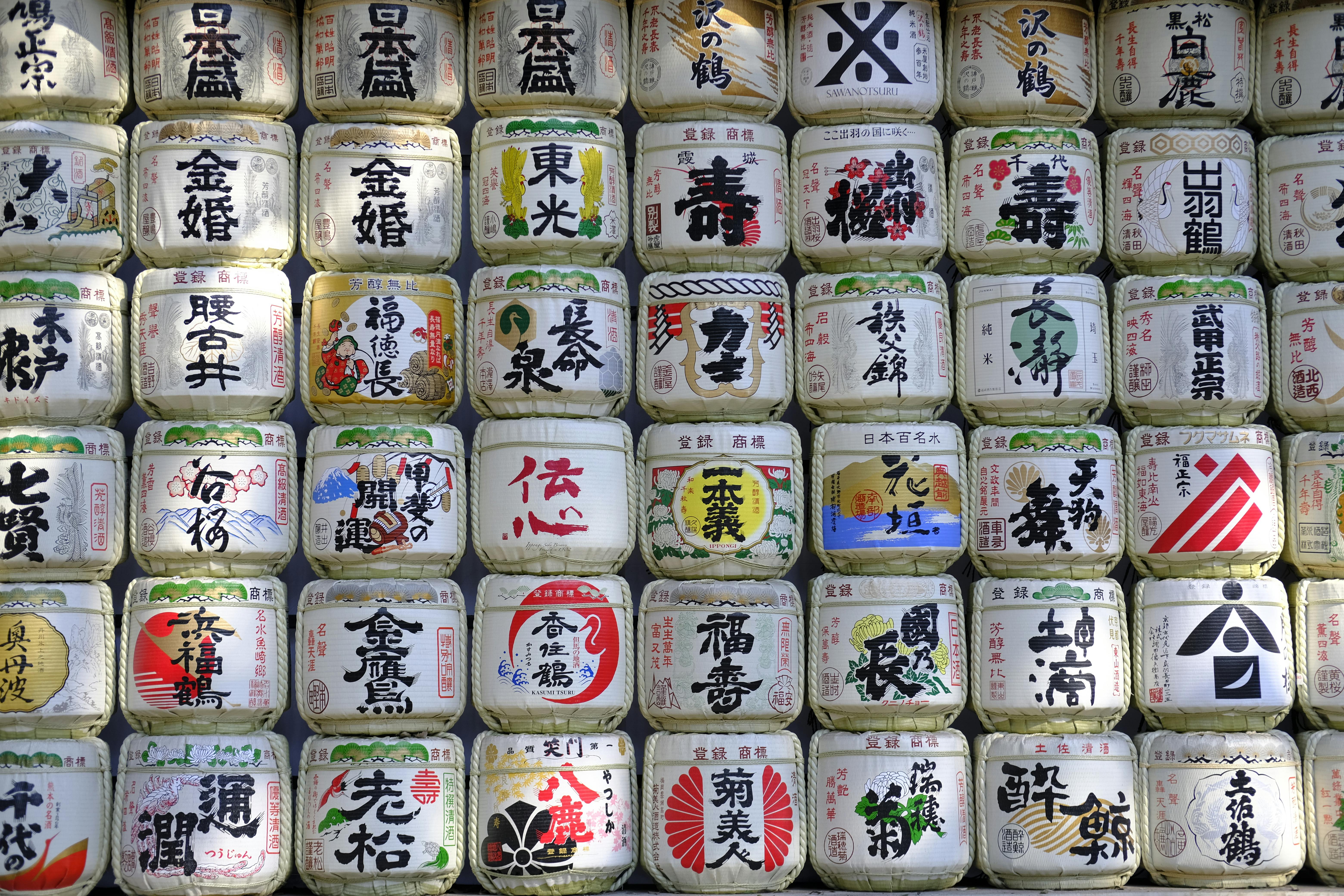 Colorful display of traditional Japanese sake barrels in Tokyo, showcasing cultural heritage.