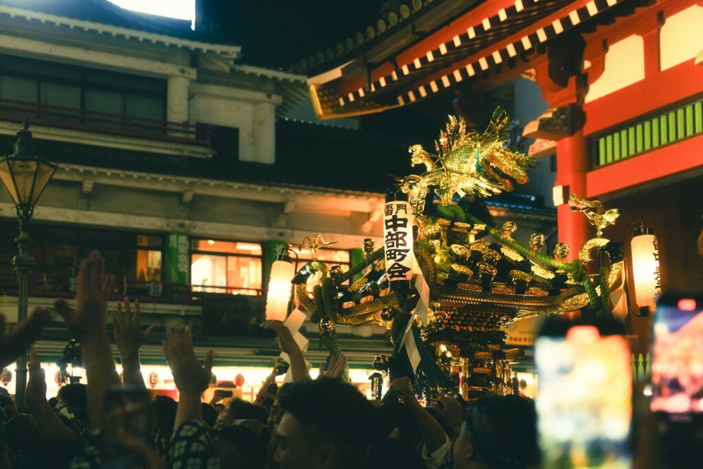 a group of people holding up their cell phones